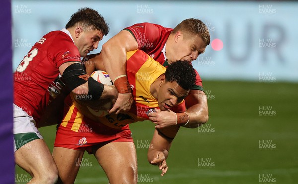 311022 - Papua New Guinea v Wales - Rugby League World Cup 2021 - Connor Davies of Wales Rugby League ad Dan Fleming of Wales Rugby League stop Jacob Alick of PNG from going over the line