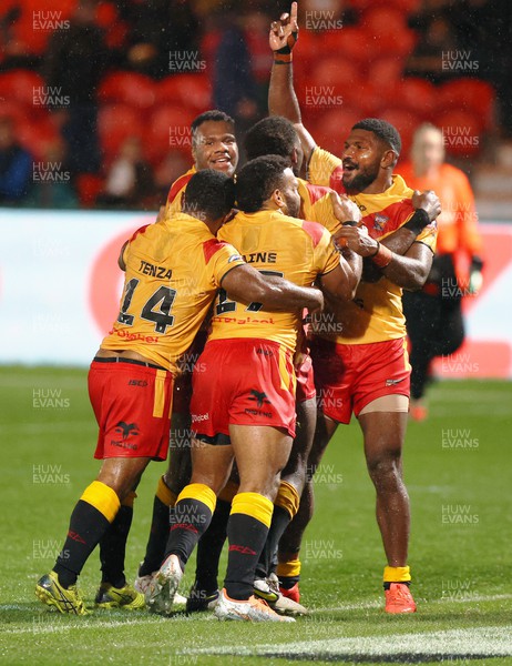 311022 - Papua New Guinea v Wales - Rugby League World Cup 2021 - PNG celebrate on the last try of the match