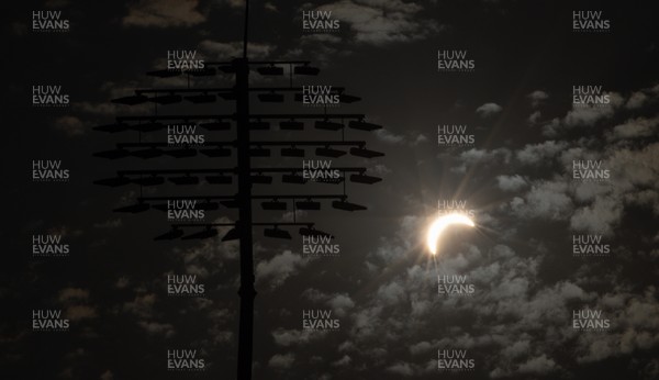 120826 - The partial solar eclipse takes place behind the floodlights of Sophia Gardens Cricket Ground in Cardiff, Wales