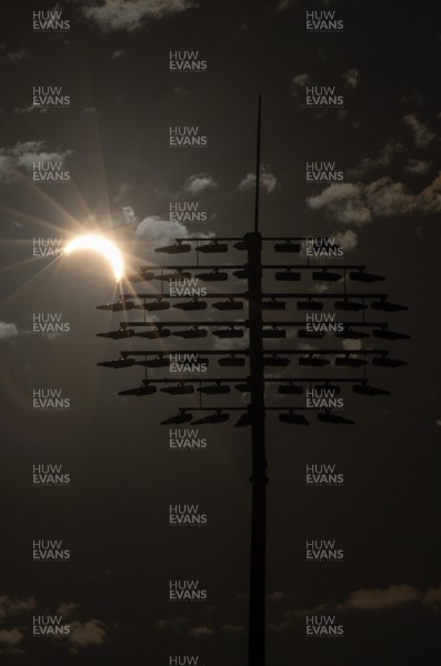 120826 - The partial solar eclipse takes place behind the floodlights of Sophia Gardens Cricket Ground in Cardiff, Wales