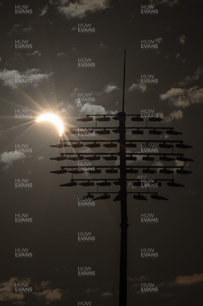 120826 - The partial solar eclipse takes place behind the floodlights of Sophia Gardens Cricket Ground in Cardiff, Wales