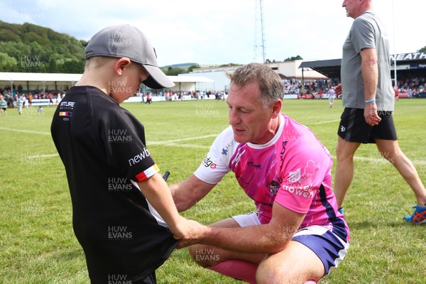 270719 - Paul James Testimonial -  Allen Bateman signs a jersey for  young fan after the game  