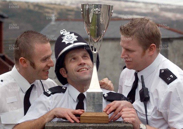 310103 - Acting Sergeant Paul Phillips (centre), full back for Bedwas rugby club, with the Principality Cup and colleagues Marlon Miles (l) and Simon Davies (r)