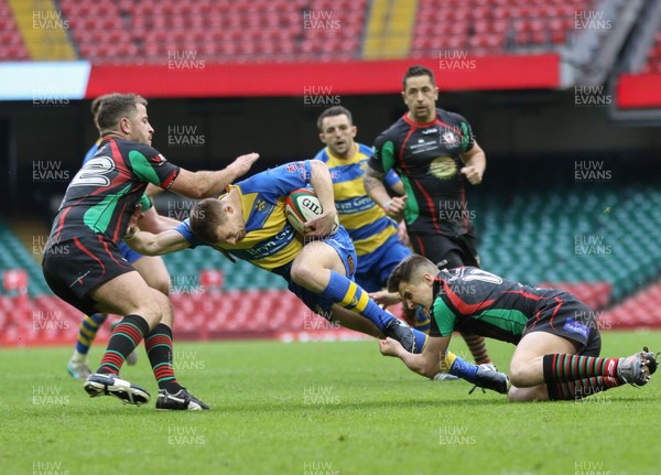 160417 - Penallta v Ystalyfera, WRU National Plate Final - Kieran Mahoney of Penallta is tackled by Jonathan Bayliss of Ystalyfera