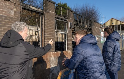 031225 - Penarth RFC Clubhouse Fire - Dan Mears, Penarth RFC Secretary with Cardiff Rugby and Welsh internationals Mason Grady and Evan Lloyd at the Penarth RFC Clubhouse which was devastated by a recent fire
