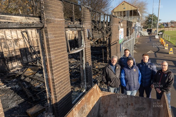 031225 - Penarth RFC Clubhouse Fire - Welsh Rugby Union Community Director Geraint John with Dan Mears, Penarth RFC Secretary and Alan Cozens Penarth RFC Commercial secretary along with Cardiff Rugby and Welsh internationals Mason Grady and Evan Lloyd at the Penarth RFC Clubhouse which was devastated by a recent fire