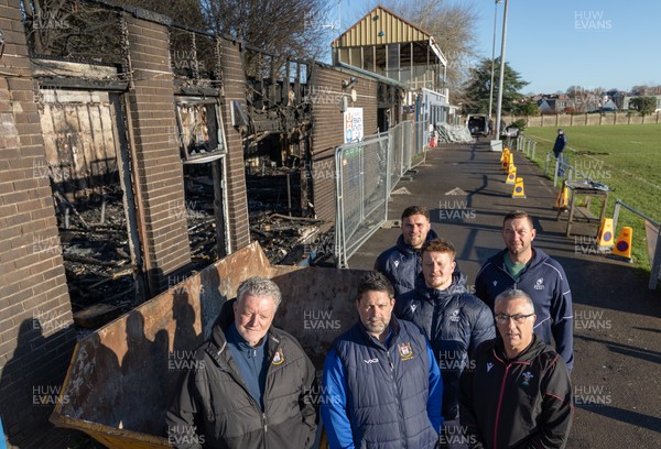 031225 - Penarth RFC Clubhouse Fire - Welsh Rugby Union Community Director Geraint John with Dan Mears, Penarth RFC Secretary and Alan Cozens Penarth RFC Commercial secretary along with Cardiff Rugby and Welsh internationals Mason Grady and Evan Lloyd and Cardiff Rugby Club head coach Corniel van Zyl at the Penarth RFC Clubhouse which was devastated by a recent fire