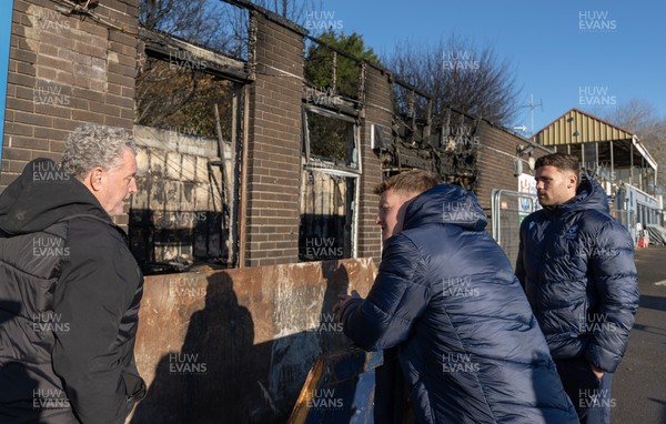 031225 - Penarth RFC Clubhouse Fire - Dan Mears, Penarth RFC Secretary with Cardiff Rugby and Welsh internationals Mason Grady and Evan Lloyd at the Penarth RFC Clubhouse which was devastated by a recent fire
