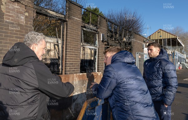 031225 - Penarth RFC Clubhouse Fire - Dan Mears, Penarth RFC Secretary with Cardiff Rugby and Welsh internationals Mason Grady and Evan Lloyd at the Penarth RFC Clubhouse which was devastated by a recent fire
