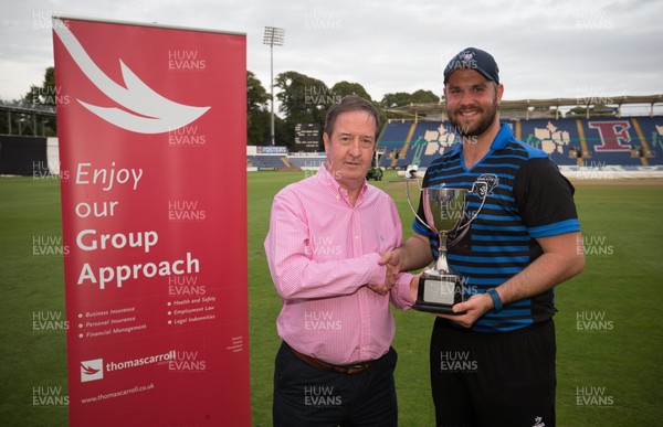 130817 - Penarth v Port Talbot Pirates, South Wales Premier League T20 Final - Josh Tobin, captain of Port Talbot recieves the trophy from Paul Morgan, Chairman South Wales Premier Cricket League