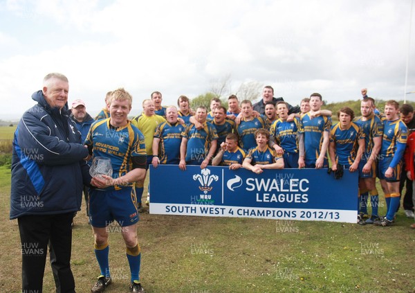 110513 Penlan RFC - Division 4 South West Champions -Penlan captain Ian Scrine receives the trophy from WRU's Geraint Edwards