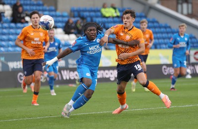 011125 - Peterborough United v Cardiff City - FA Cup First Round - Alex Robertson of Cardiff and Abraham Odoh of Peterborough