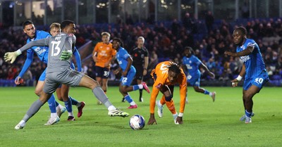 011125 - Peterborough United v Cardiff City - FA Cup First Round - Tanaswa Nyakuhwa of Cardiff and Goalkeeper Nathan Trott of Cardiff try for a goal in stoppage time at the end of the match