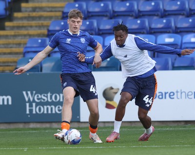011125 - Peterborough United v Cardiff City - FA Cup First Round - Warm up…Dylan Lawlor of Cardiff and Ronan Kpakio of Cardiff