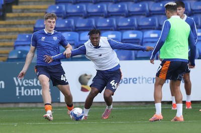 011125 - Peterborough United v Cardiff City - FA Cup First Round - Warm up…Dylan Lawlor of Cardiff and Ronan Kpakio of Cardiff
