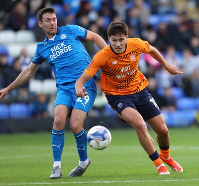 011125 - Peterborough United v Cardiff City - FA Cup First Round - Rubin Colwill of Cardiff and Tom O’Connor of Peterborough