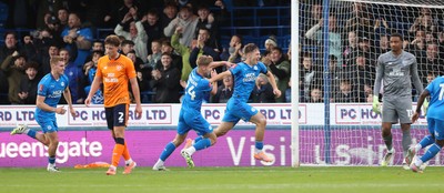 011125 - Peterborough United v Cardiff City - FA Cup First Round - Goalkeeper Nathan Trott of Cardiff and Will Fish of Cardiff dejected as Harry Leonard of Peterborough celebrates his winning goal