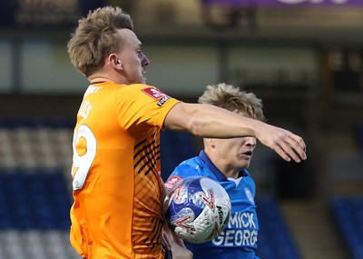 011125 - Peterborough United v Cardiff City - FA Cup First Round - Isaak Davies of Cardiff and Harley Mills of Peterborough