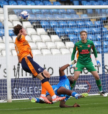 011125 - Peterborough United v Cardiff City - FA Cup First Round - Will Fish of Cardiff tries a header for goal but is stopped by Peter Kioso of Peterborough