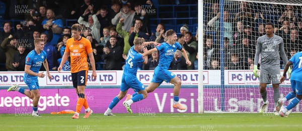 011125 - Peterborough United v Cardiff City - FA Cup First Round - Goalkeeper Nathan Trott of Cardiff and Will Fish of Cardiff dejected as Harry Leonard of Peterborough celebrates his winning goal