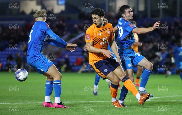 011125 - Peterborough United v Cardiff City - FA Cup First Round - Yousef Saleh of Cardiff is sandwiched by Harley Mills of Peterborough and Peter Kioso of Peterborough