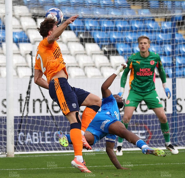 011125 - Peterborough United v Cardiff City - FA Cup First Round - Will Fish of Cardiff tries a header for goal but is stopped by Peter Kioso of Peterborough