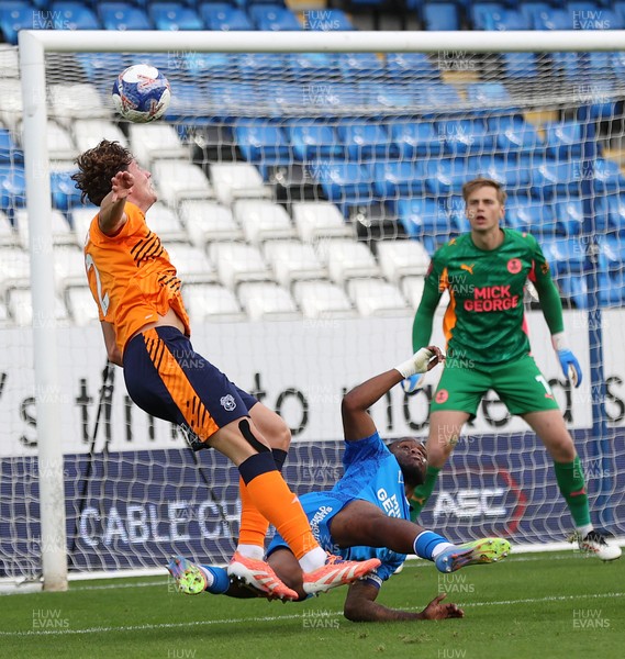 011125 - Peterborough United v Cardiff City - FA Cup First Round - Will Fish of Cardiff tries a header for goal but is stopped by Peter Kioso of Peterborough