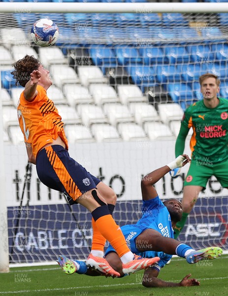 011125 - Peterborough United v Cardiff City - FA Cup First Round - Will Fish of Cardiff tries a header for goal but is stopped by Peter Kioso of Peterborough