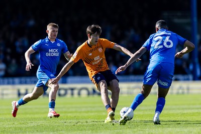 060426 - Peterborough United v Cardiff City - Sky Bet League 1 - Rubin Colwill of Cardiff City wins the ball from David Okagbue of Peterborough United