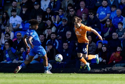 060426 - Peterborough United v Cardiff City - Sky Bet League 1 - Cian Ashford of Cardiff City and James Dornelly of Peterborough United