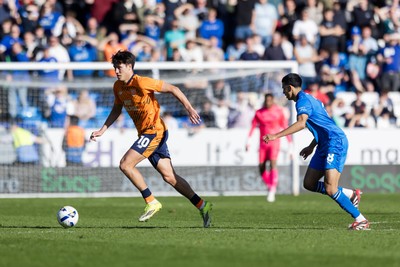 060426 - Peterborough United v Cardiff City - Sky Bet League 1 - Rubin Colwill of Cardiff City wins the ball Brandon Khela of Peterborough United