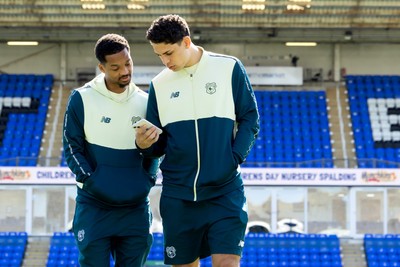 060426 - Peterborough United v Cardiff City - Sky Bet League 1 - Chris Willock of Cardiff City and Yousef Salech of Cardiff City