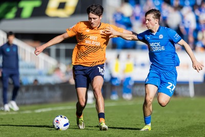 060426 - Peterborough United v Cardiff City - Sky Bet League 1 - Rubin Colwill of Cardiff City and Harry Leonard of Peterborough United