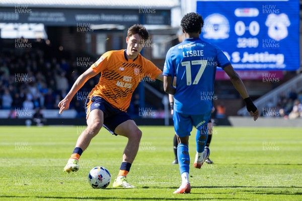060426 - Peterborough United v Cardiff City - Sky Bet League 1 - Rubin Colwill of Cardiff City and Kyrell Lisbie of Peterborough United