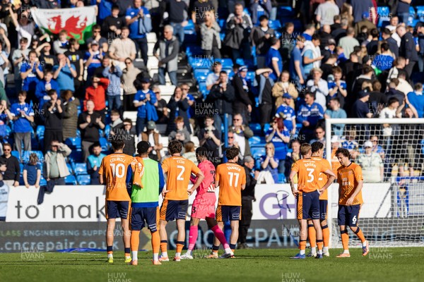060426 - Peterborough United v Cardiff City - Sky Bet League 1 - Cardiff City players applaud the fans after the match 