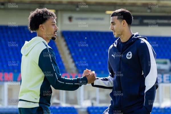 060426 - Peterborough United v Cardiff City - Sky Bet League 1 - Calum Scanlon of Cardiff City with Peterborough United’s Brandon Khela