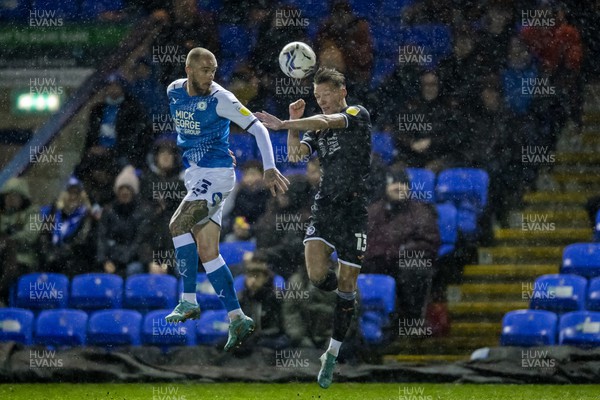160322 - Peterborough United v Swansea City - Sky Bet Championship - Hannes Wolf of Swansea City challenges for the ball against Joe Ward of Peterborough United