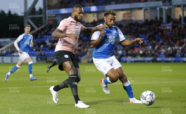 170821 - Peterborough v Cardiff City - Sky Bet Championship - Leandra Bacuna of Cardiff tussles with Nathan Thompson of Peterborough for the ball