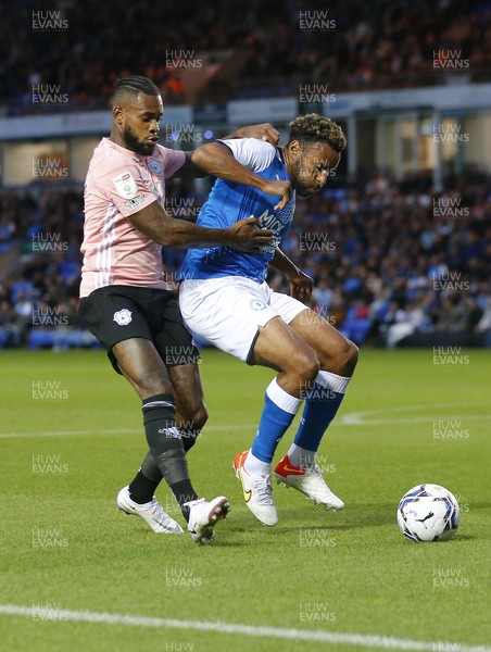 170821 - Peterborough v Cardiff City - Sky Bet Championship - Leandra Bacuna of Cardiff tussles with Nathan Thompson of Peterborough for the ball