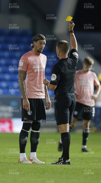 170821 - Peterborough v Cardiff City - Sky Bet Championship - Aden Flint of Cardiff gets a yellow card from referee Thomas Bramall