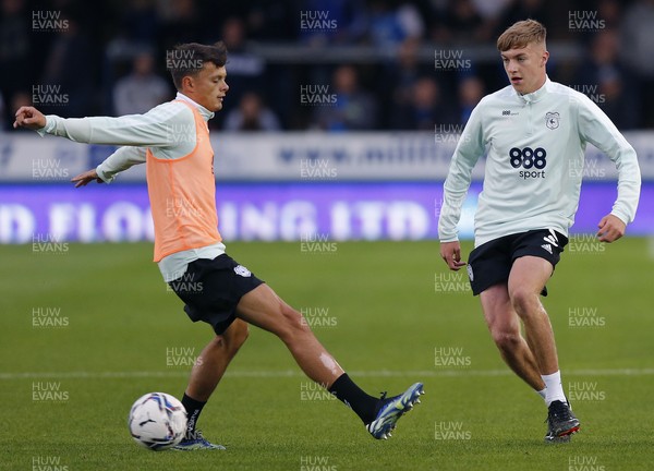 170821 - Peterborough v Cardiff City - Sky Bet Championship - Joel Bagan of Cardiff and Perry Ng of Cardiff warm up before the match