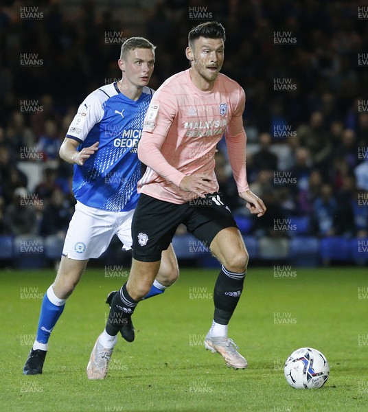 170821 - Peterborough v Cardiff City - Sky Bet Championship - Kieffer Moore of Cardiff is closely marked