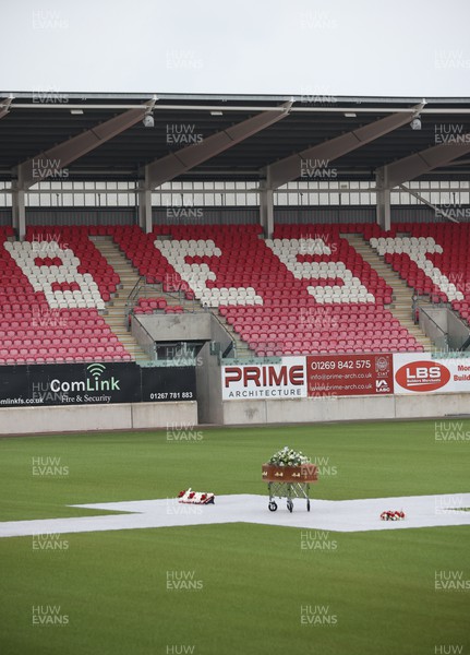 240622 - Memorial service for Phil Bennett OBE, former Llanelli, Wales & Lions player at Parc y Scarlets - Phil Bennett’s coffin on the pitch at Parc y Scarlets during the Memorial Service