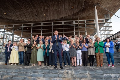 090526 - Picture shows Plaid Cymru leader Rhun Ap Lorwerth and Plaid Cymru’s 43 newly elected Senedd members at the Senedd in Cardiff to mark history in Wales as a new government is elected