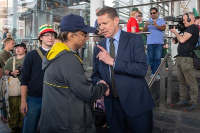 090526 - Picture shows Plaid Cymru leader Rhun Ap Lorwerth greeting supporters outside the Senedd in Cardiff, after winning the Welsh Election