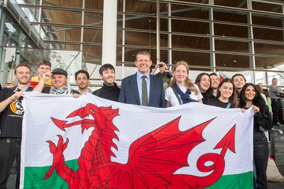 090526 - Picture shows Plaid Cymru leader Rhun Ap Lorwerth greeting supporters outside the Senedd in Cardiff, after winning the Welsh Election