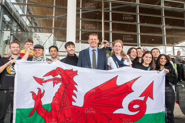 090526 - Picture shows Plaid Cymru leader Rhun Ap Lorwerth greeting supporters outside the Senedd in Cardiff, after winning the Welsh Election