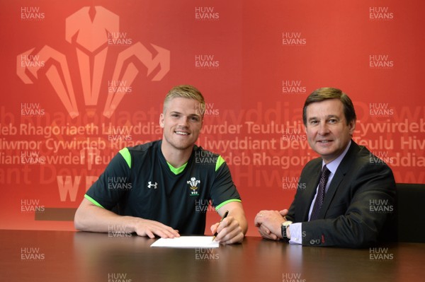 180315 - WRU -Gareth Anscombe after signing a National Dual Contract with WRU Chief Executive Roger Lewis