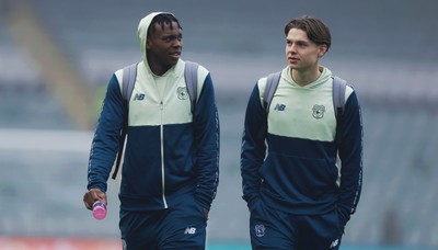 210226 - Plymouth Argyle v Cardiff City - Sky Bet League 1 - Ronan Kpakio of Cardiff City and Cian Ashford of Cardiff City arrives ahead of the match
