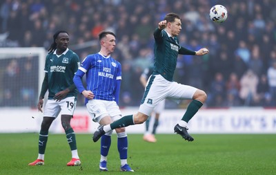 210226 - Plymouth Argyle v Cardiff City - Sky Bet League 1 - David Turnbull of Cardiff City is beaten by Mathias Ross of Plymouth Argyle
